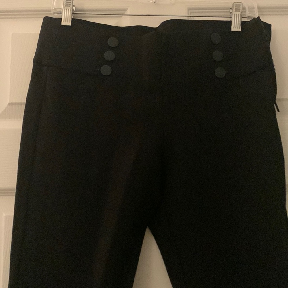NWOT Black Ponte high waisted, hip buttons. Side zipper. Slim cut ankle length
